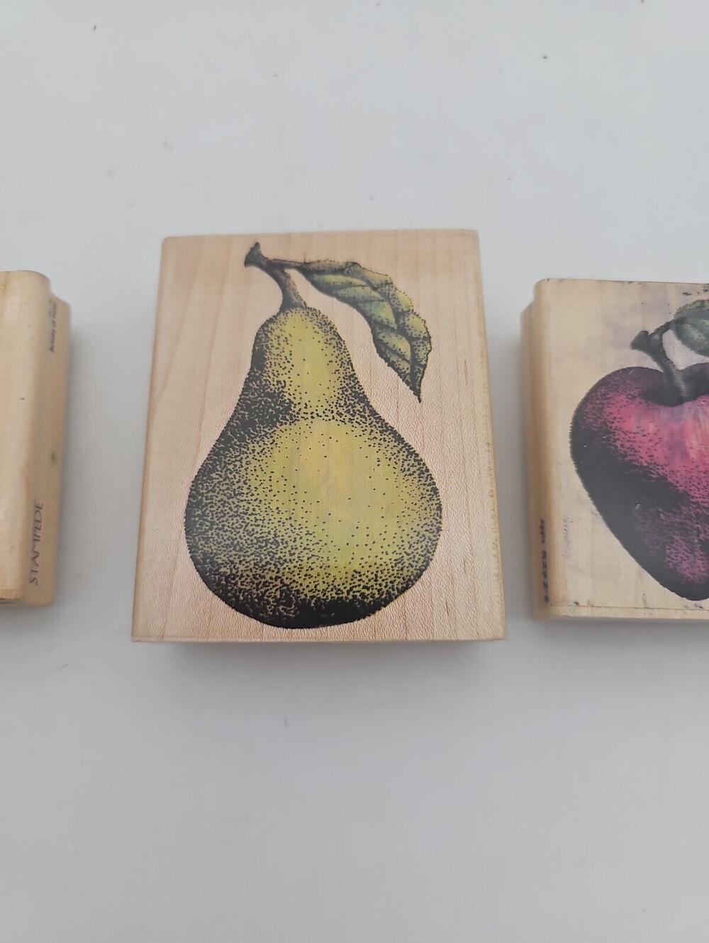 Lot of 3 vintage wood mounted rubber stamps: detailed pear, apple, and fern.